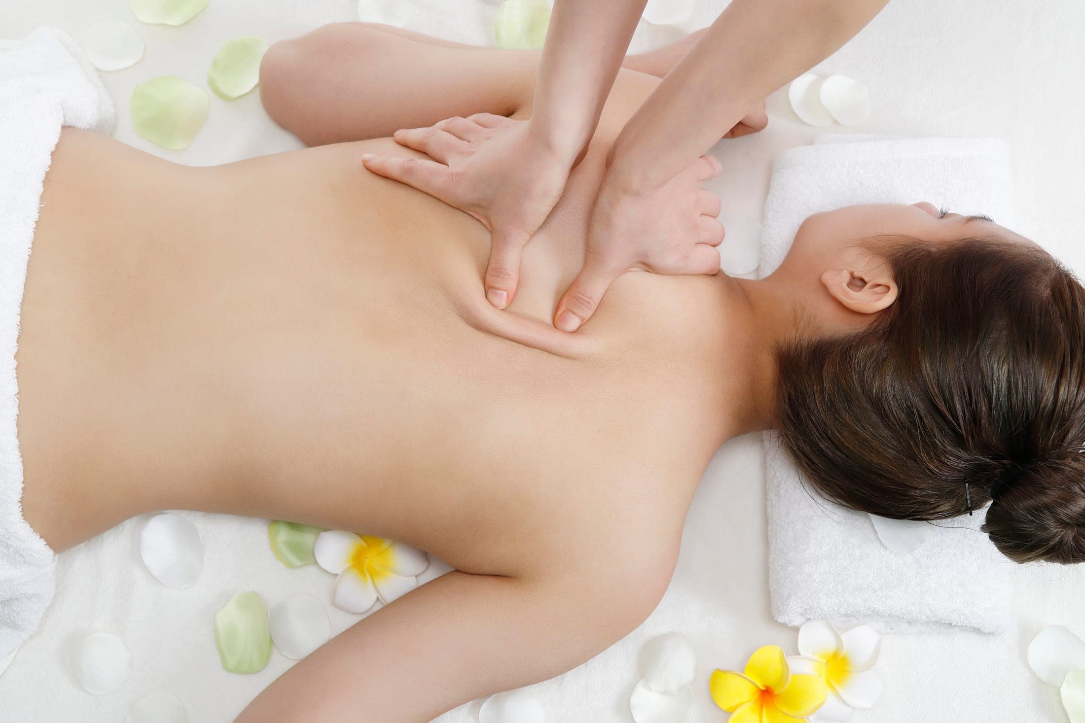 Deep tissue massage on a client's back